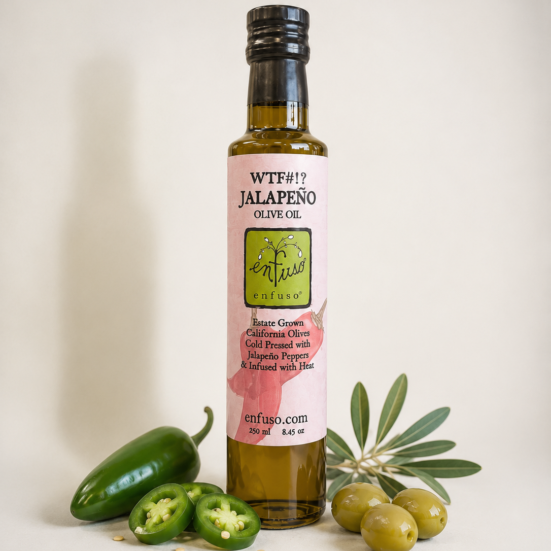 Bottle of Wiffo Jalapeno Olive Oil with jalapenos and olives on a light background