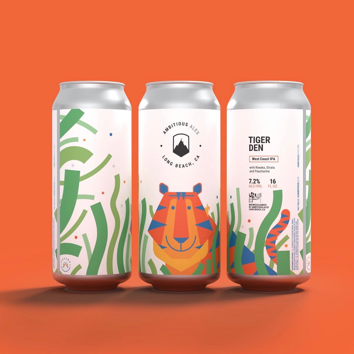 Three aluminum beverage cans standing upright on an orange background. The cans have white labels with colorful tropical and animal illustrations, including green leaves, a tiger face, and text reading 'TIGER DEN' and 'HABITOUS LIFE LONG BEACH, FL'.
